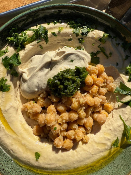 What is hummus — fresh hummus with schug, chickpeas and tahini at Mazal Mediterranean Street Food, Charleston SC