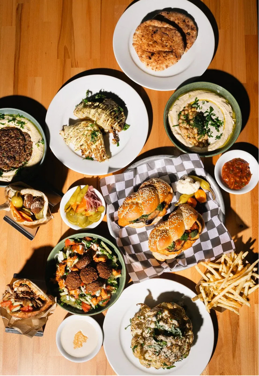 Mediterranean food spread at Mazal — hummus, shawarma, falafel and Israeli salads in Charleston SC