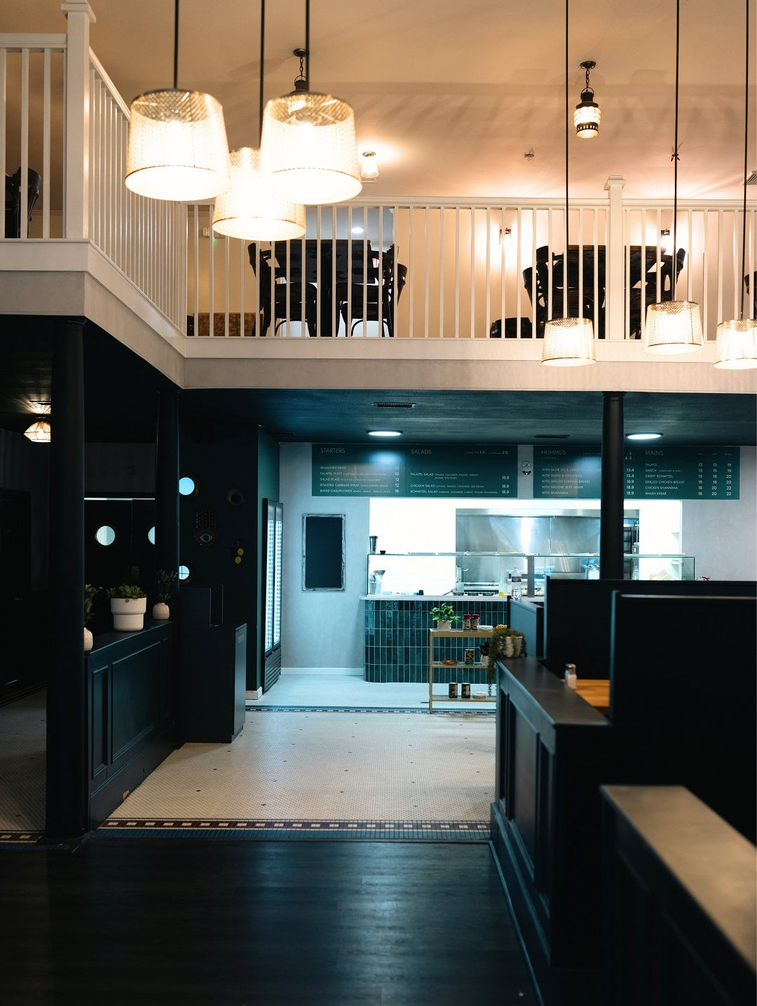 Interior of Mazal Shawarma & Grill in Charleston, featuring warm lighting, modern seating, and a welcoming dining atmosphere.